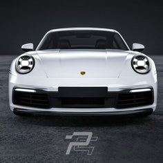 White Porsche car on a dark background